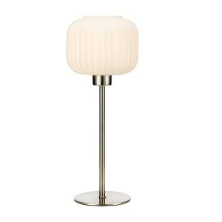 srebrna lampa stołowa na cienkiej nóżce