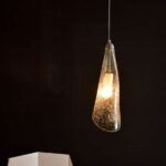 Designerska lampa wisząca ze szklanym nieregularnym kloszem