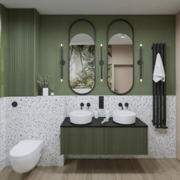 zielona łazienka z lastryko i szafką ryflowaną z owalnym lustrem
