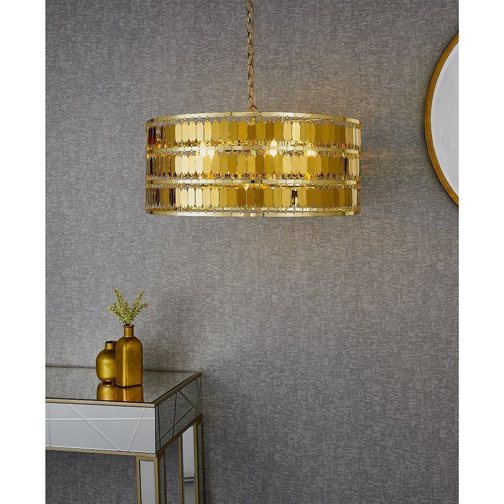 złota lampa na szarej ścianie glamour