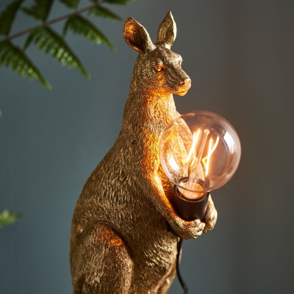 złoty kangur trzyma żarówkę lampa do salonu
