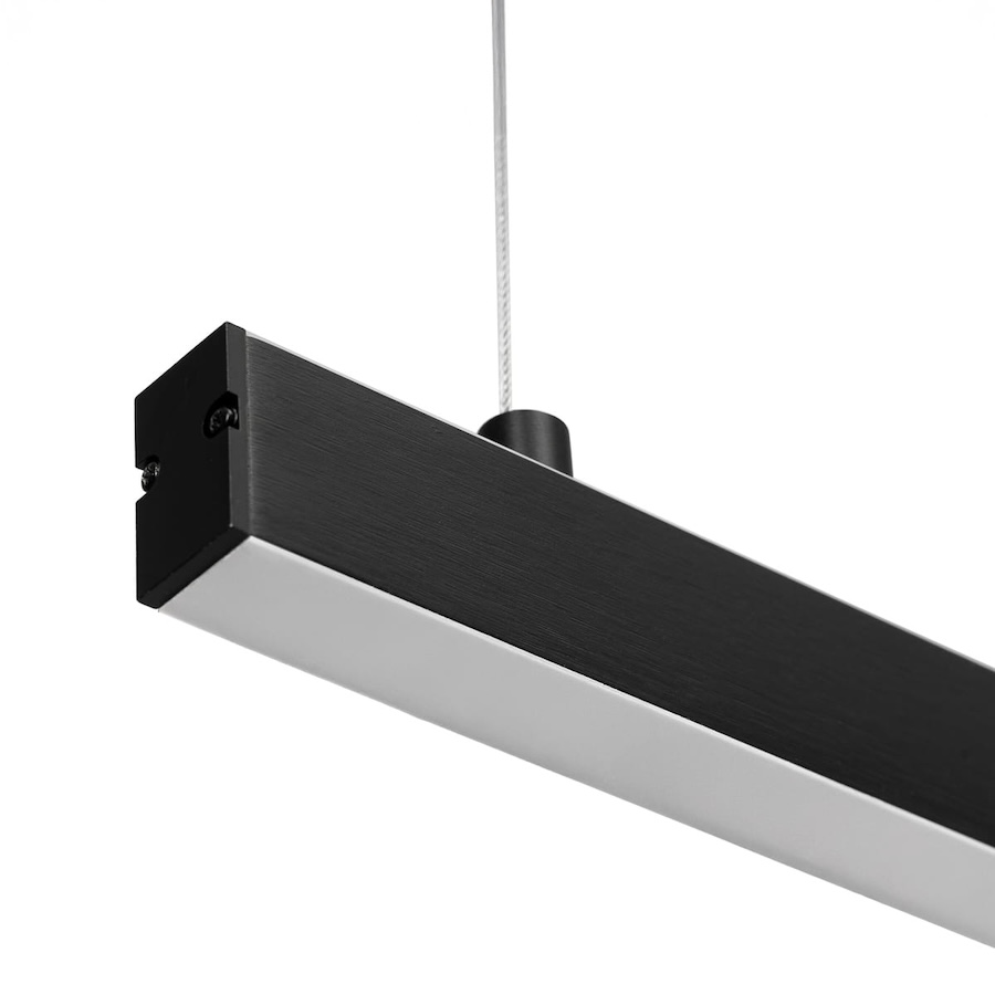 czarna waska dluga lampa wiszaca nad blat