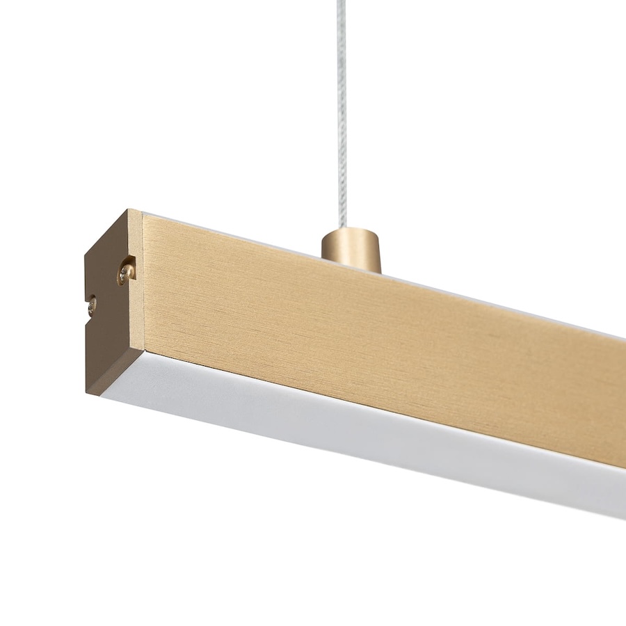 zlota podłuzna lampa wiszaca nad blat