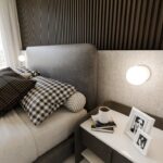 Biała lampa ścienna Bior - nad łóżko do sypialni