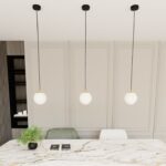 Czarno-złota lampa wisząca nad stół w salonie Royal