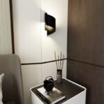 Designerski kinkiet do salonu Spiner - z czarnego metalu