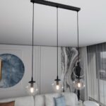 Transparentna lampa wisząca nad stół w salonie Cosmo 3