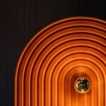 Owalny kinkiet do pokoju dziecka Minos 2 czerwona terakota - zamszowe wykończenie - widoczne żarówki