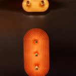 Zamszowy kinkiet Minos 2 żółty piasek - owalny nowoczesny - widoczne żarówki