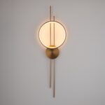 Złoty kinkiet Ecliptica do sypialni - okrągły ring LED - nowoczesny