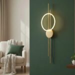 Złoty kinkiet Ecliptica - z okrągłym ringiem LED